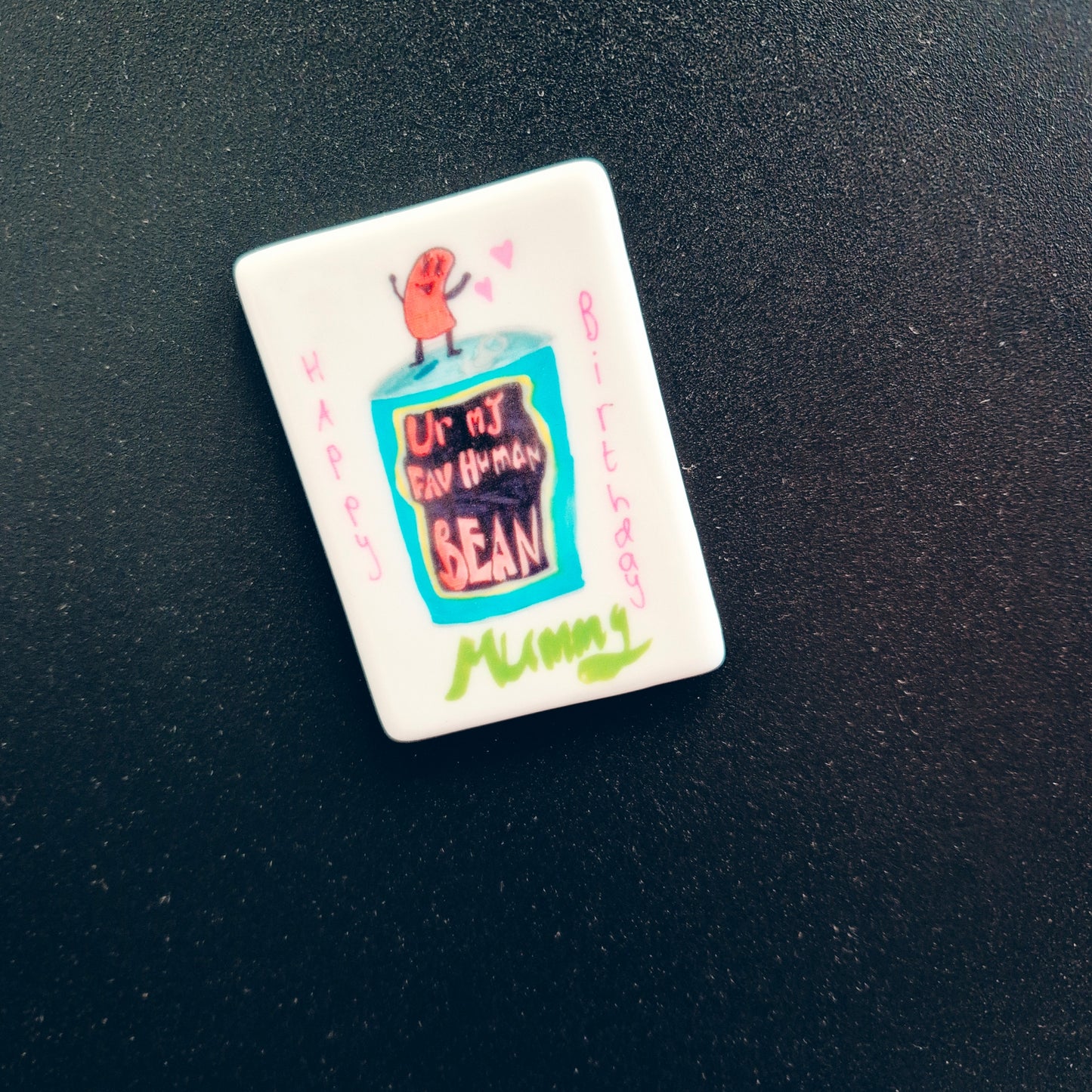 "Designed by them" fridge magnet
