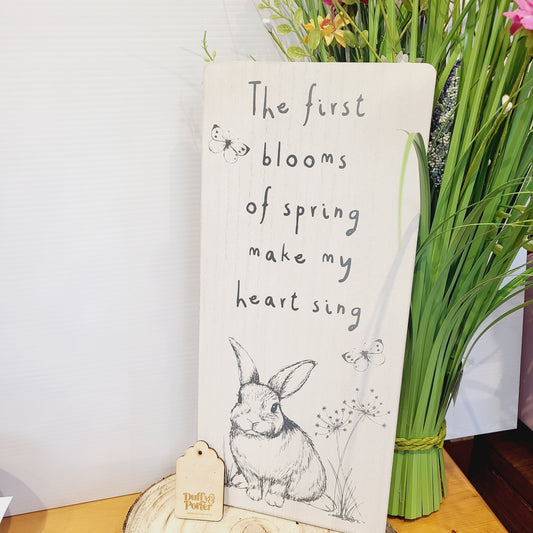 Large wooden sign. The first blooms of spring