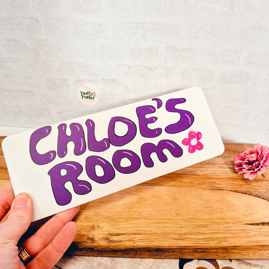 "Designed by them" bedroom door sign