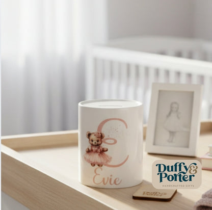 Money box. Teddy initial Pink